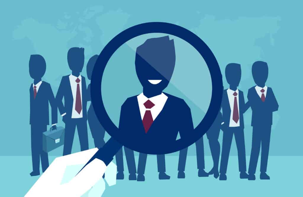 Illustration of a magnifying glass focusing on a professional individual, representing services provided by an employment attorney for workplace issues.
