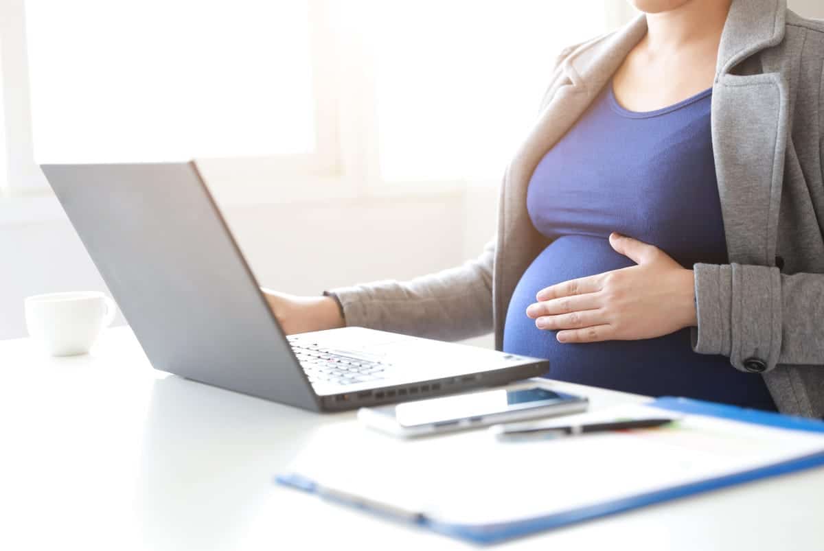 pregnant woman on a laptop