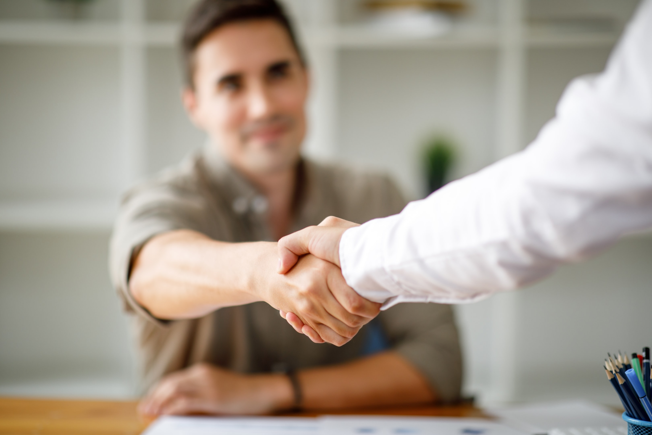 severance negotiation attorney - man shaking hands with an attorney.