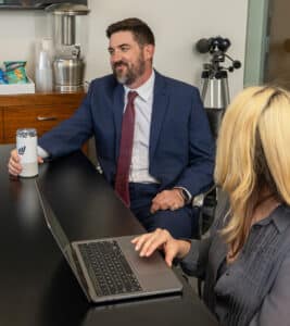 Brennan Hershey in the conference room of Hershey Law's LA employment law office reviewing a discrimination case.