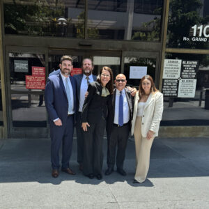 Photo of Founding Partner and President Brennan Hershey, Partner Johnny Rundell, with David-M.DeRubertis after securing landmark 27.5 million jury verdict against Dignity Health in whistleblower retaliation case